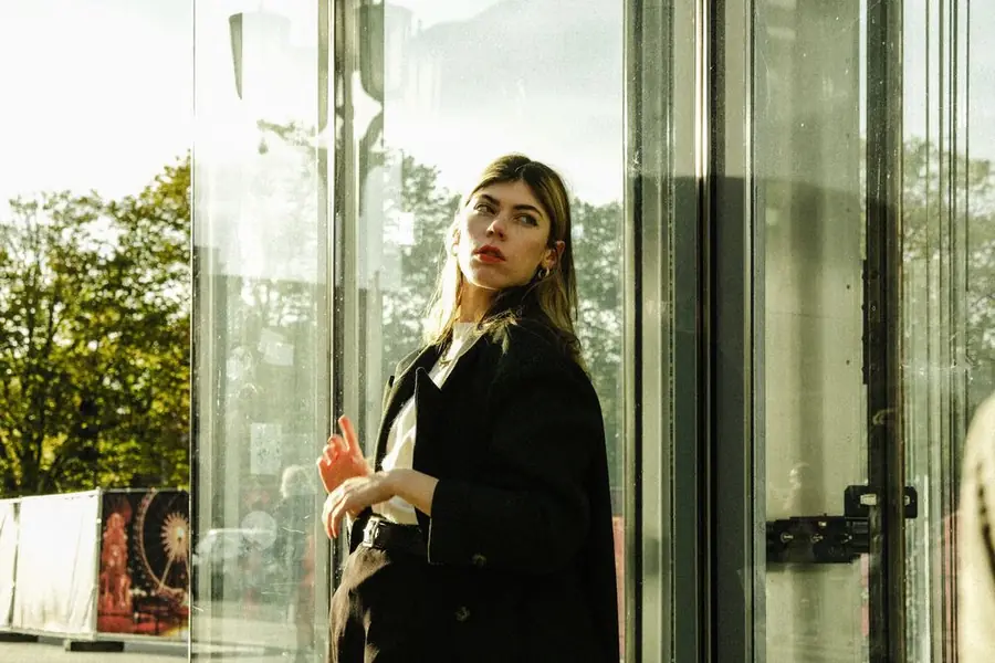 Model in a black wool coat